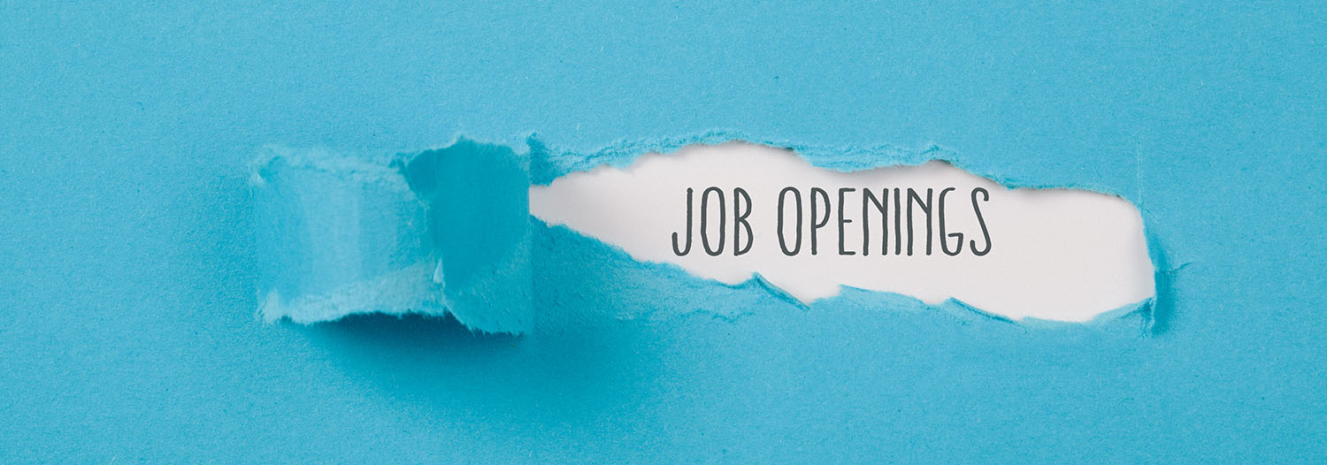 Job Openings message on torn blue paper revealing secret behind ripped opening.